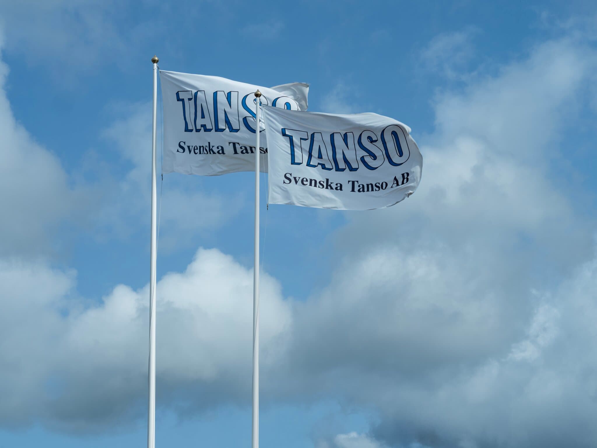 Flags with the Svenska Tanso AB logo